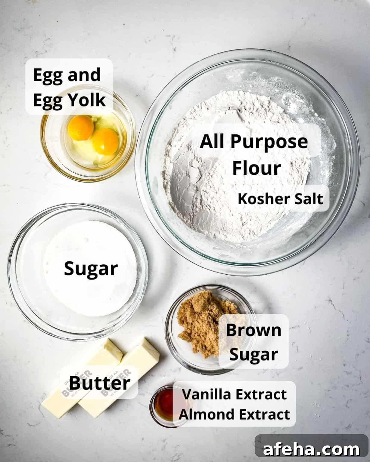 ingredients to make snowflake cookies - flour, salt, egg, egg yolk, sugar, brown sugar, vanilla extract, almond extract, and butter.