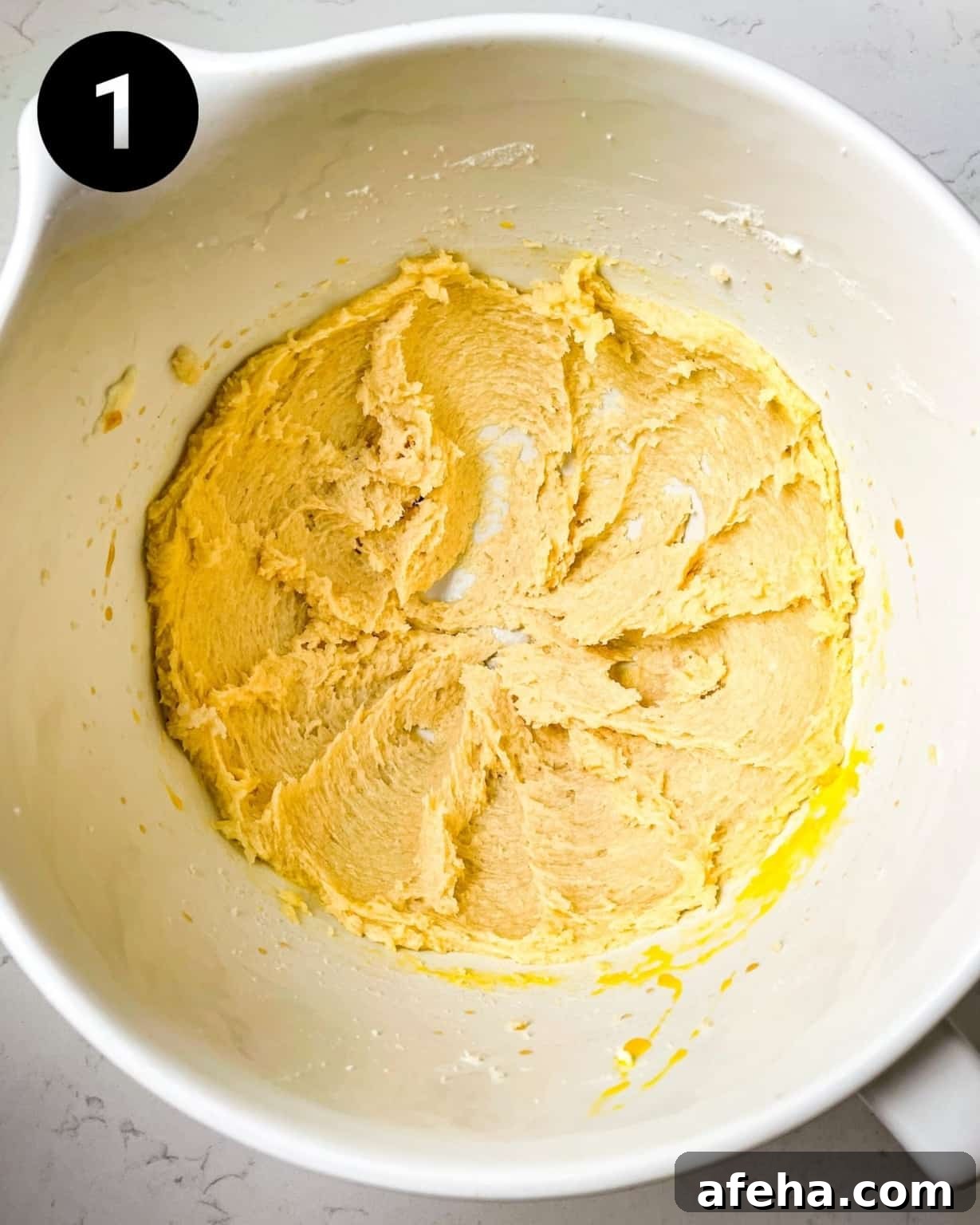 butter and sugar creamed together in a mixing bowl.