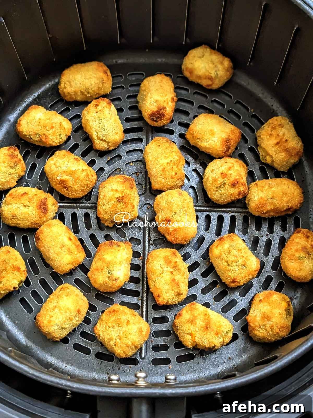 golden brown air fried veggie tots in basket.