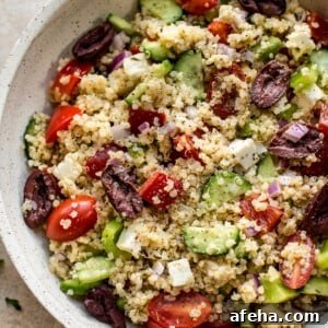 This healthy Greek quinoa salad is simple, easy to make, and delicious! The lemony vinaigrette dressing is light and flavorful. You can easily make the salad vegan by taking out the feta cheese.