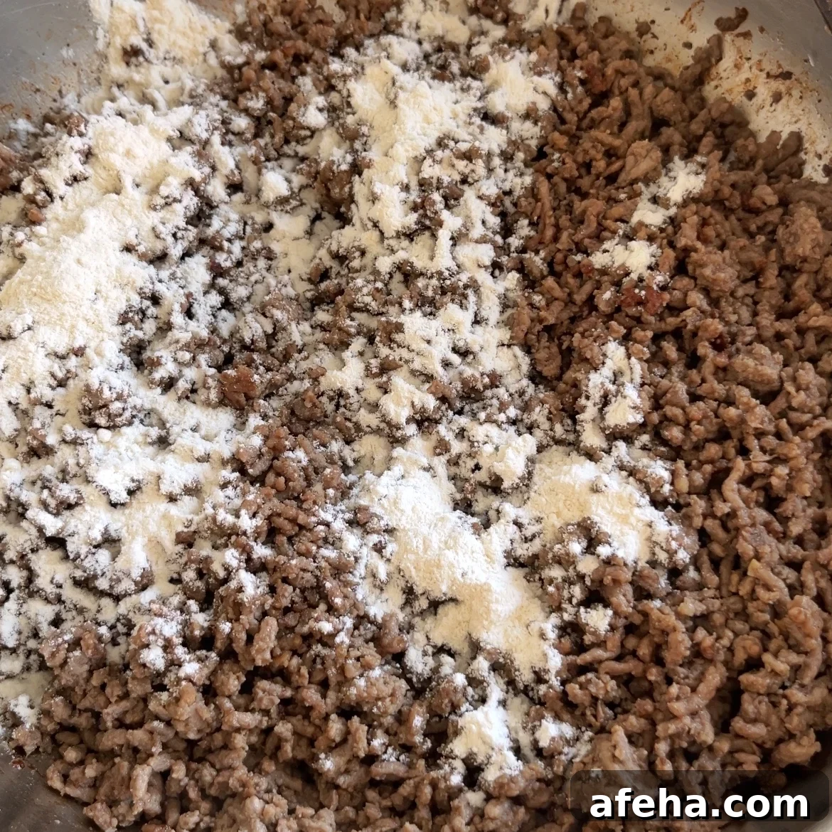 Mongolian Beef with Ground Beef: Quick Savory Stir-Fry Recipe 5 Mongolian Ground Beef cooking in a pan with white flour sprinkled on top.