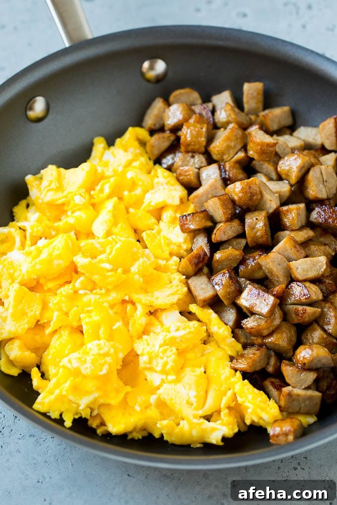 Breakfast Burrito Recipe | Sausage Breakfast Burrito Diced sausage and scrambled eggs in a pan.
