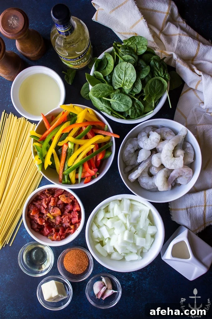 Overhead photo of ingredients for Cajun Shrimp Linguine in individual bowls.