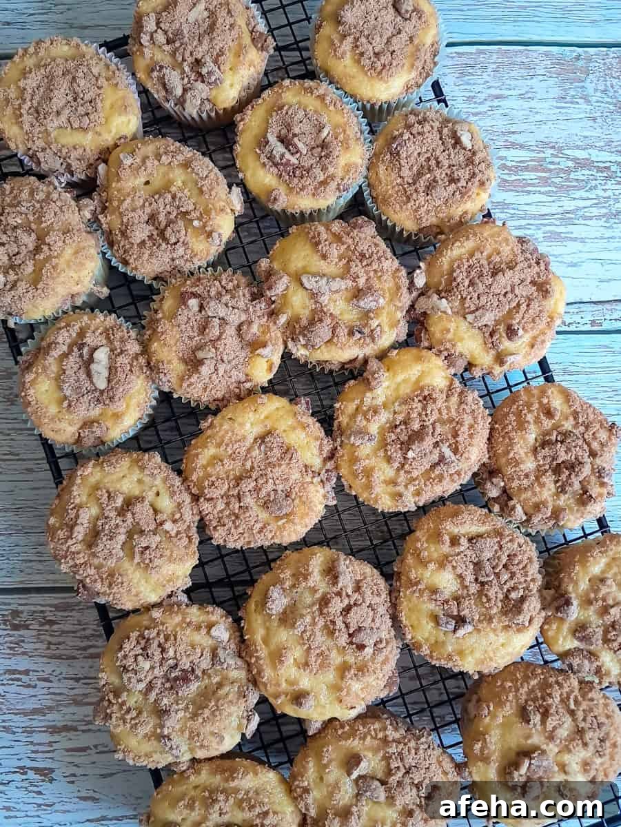 coffeecake muffins cooling on a wire rack.