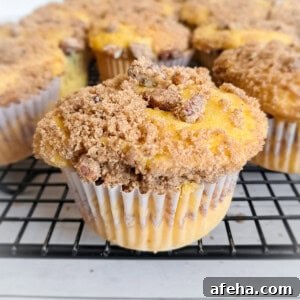 close-up of coffee cake muffins cooling on a wire rack.