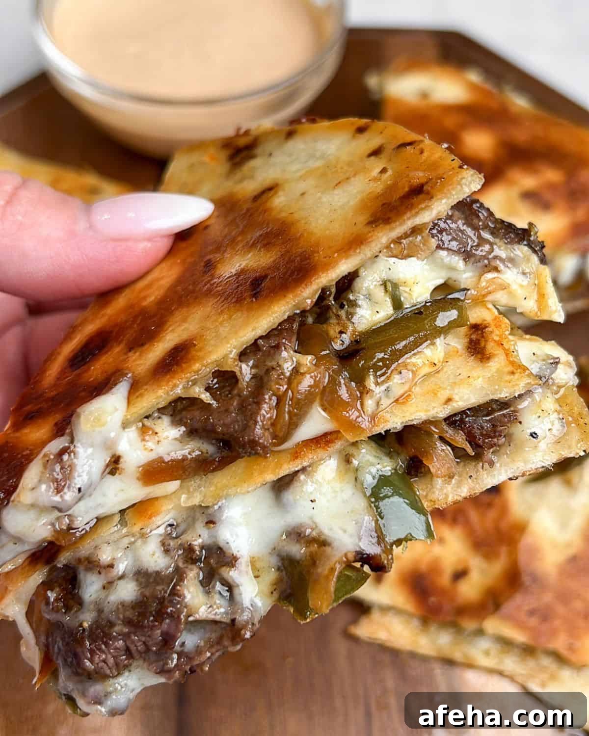 Smoky Chipotle Steak Quesadillas with Creamy Crema 3 side view of steak quesadillas with melted cheese