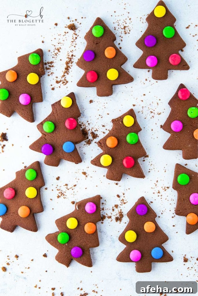 These creative, adorable, and fun cookies with M&M lights are super easy to make. M&M Christmas Tree Cookies are a kid's favorite to make and are a great treat when you are with friends, family, or company. 