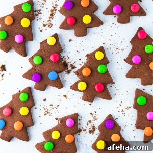 These creative, adorable, and fun cookies with M&M lights are super easy to make. M&M Christmas Tree Cookies are a kid's favorite to make and are a great treat when you are with friends, family, or company.