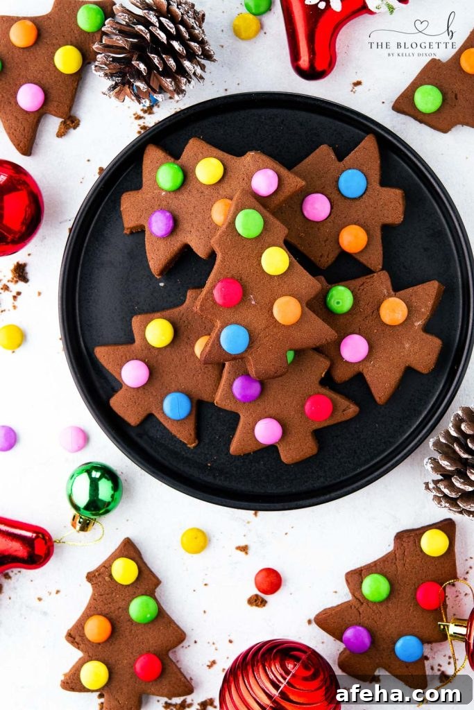 These creative, adorable, and fun cookies with M&M lights are super easy to make. M&M Christmas Tree Cookies are a kid's favorite to make and are a great treat when you are with friends, family, or company.