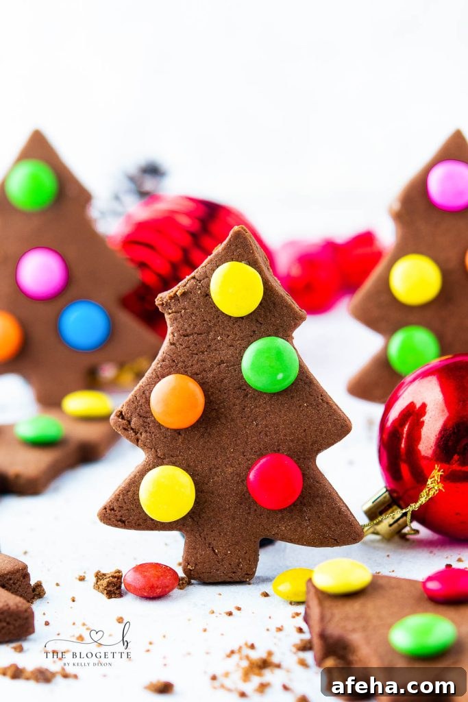 These creative, adorable, and fun cookies with M&M lights are super easy to make. M&M Christmas Tree Cookies are a kid's favorite to make and are a great treat when you are with friends, family, or company.