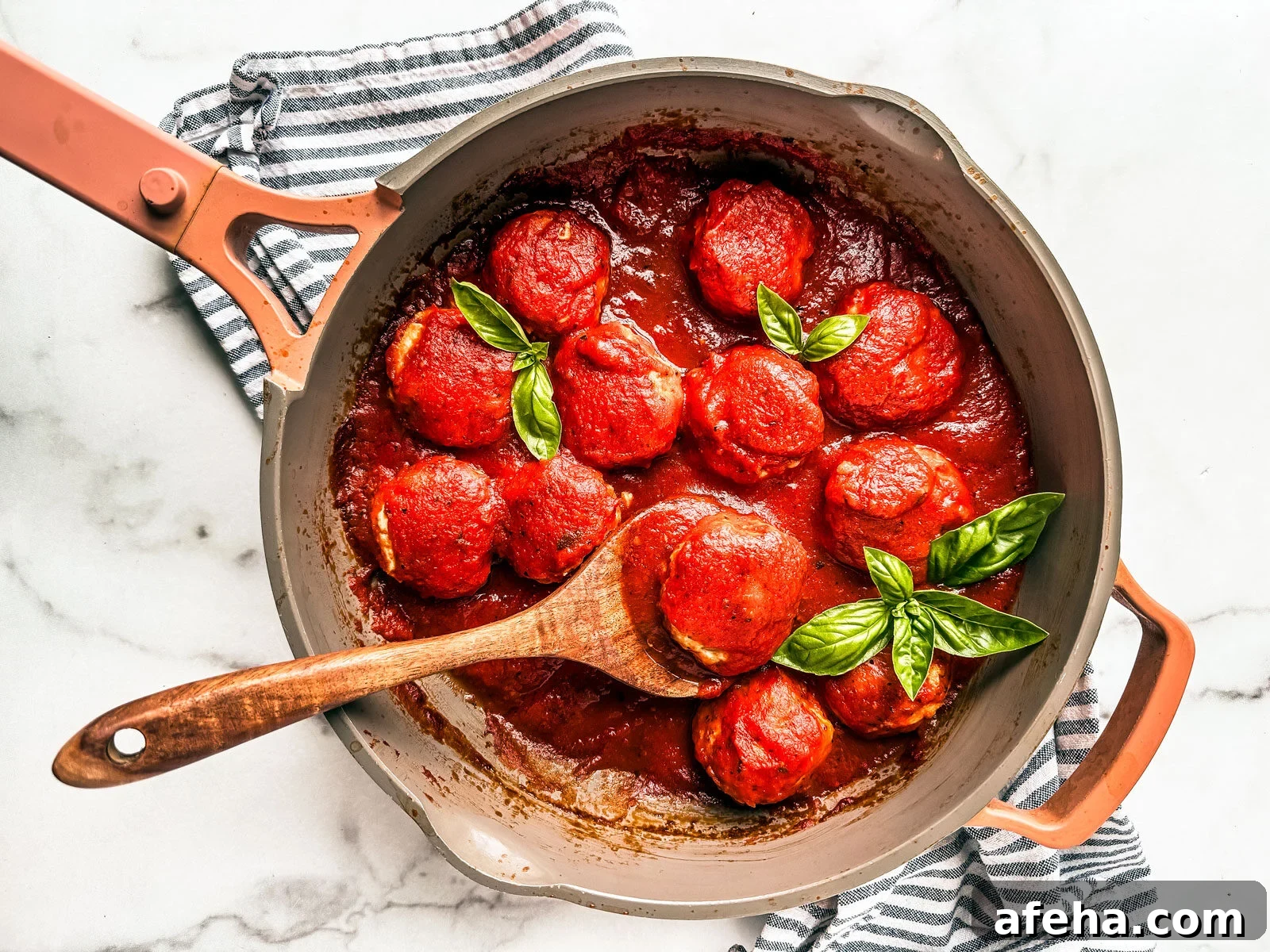 Savory Ground Chicken Meatballs with Tangy Tomato Sauce 6 Pan of saucy chicken meatballs.