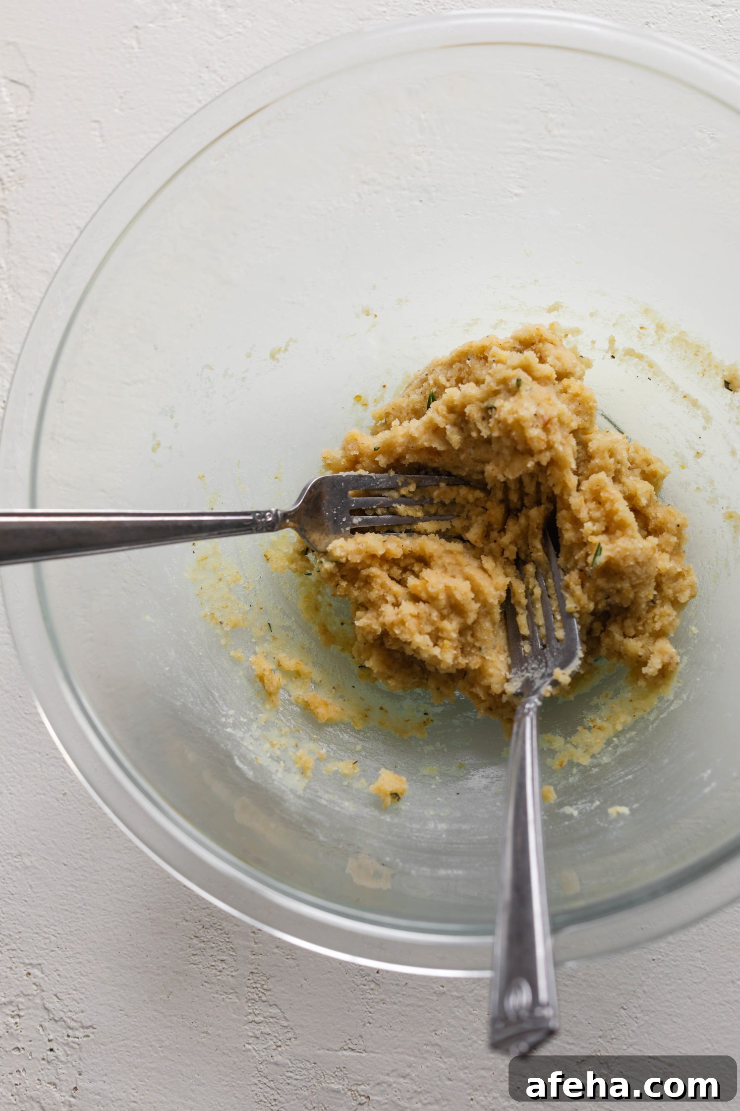 Grain-Free Almond Flour Cracker Dough mixed in bowl with two forks