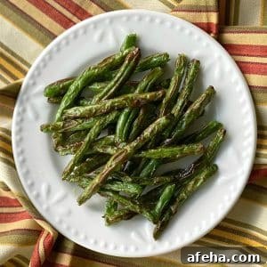 Crispy Roasted Green Beans (Air Fryer or Oven) 5 Crispy Roasted Green Beans on a plate.