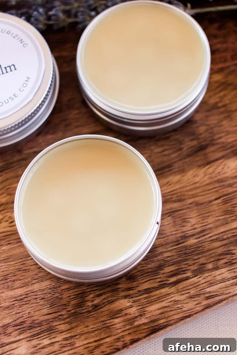 Several homemade lip balms drying in their containers.