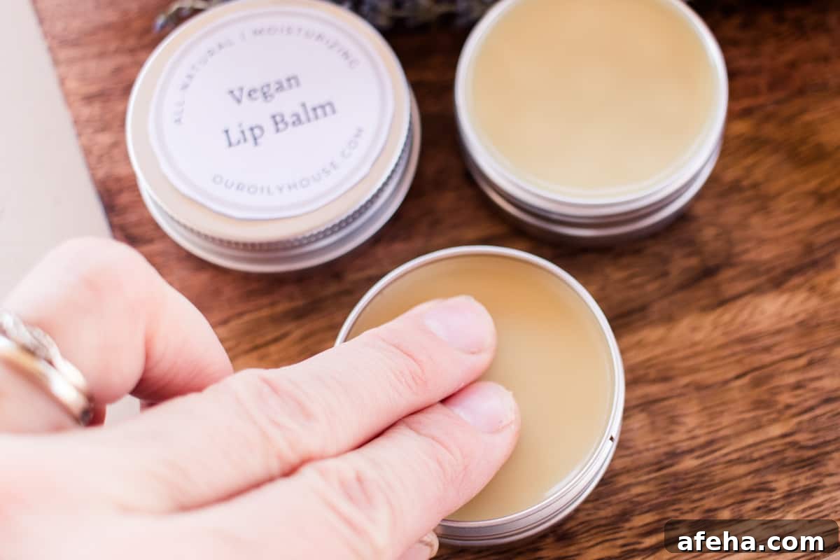 Applying vegan lip balm.