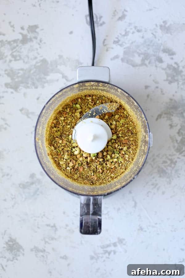 Pistachio-Crusted Fish with Lemon-Dill Aioli 3 Photo of chopped pistachios in mini food processor.