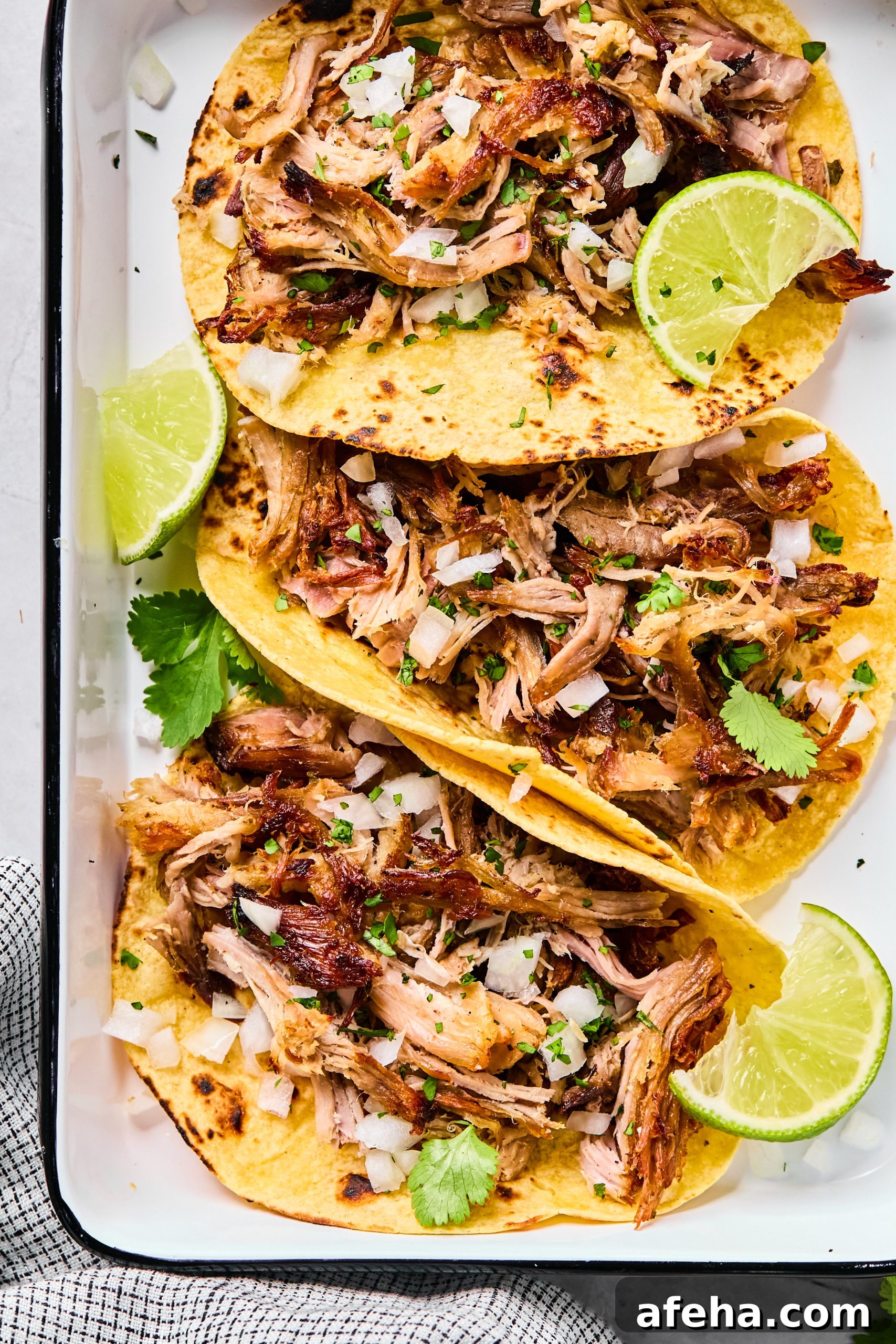 3 tacos made with crockpot carnitas as the filling