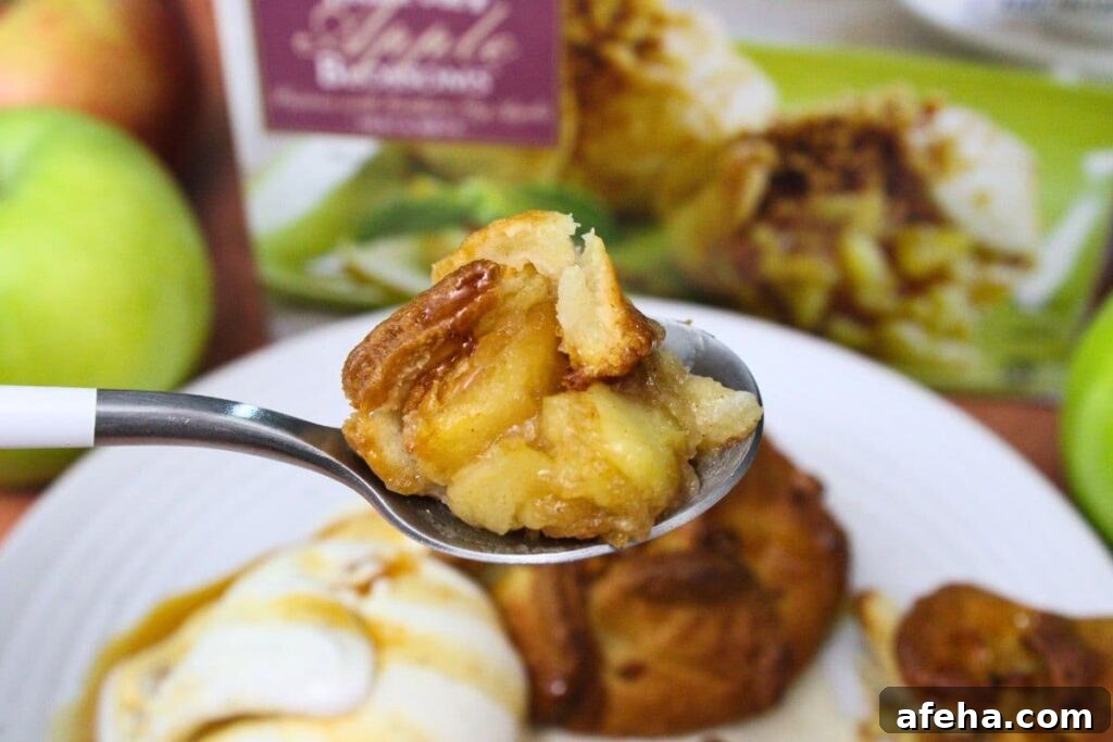 holding up a spoonful of trader joes air fryer apple blossom