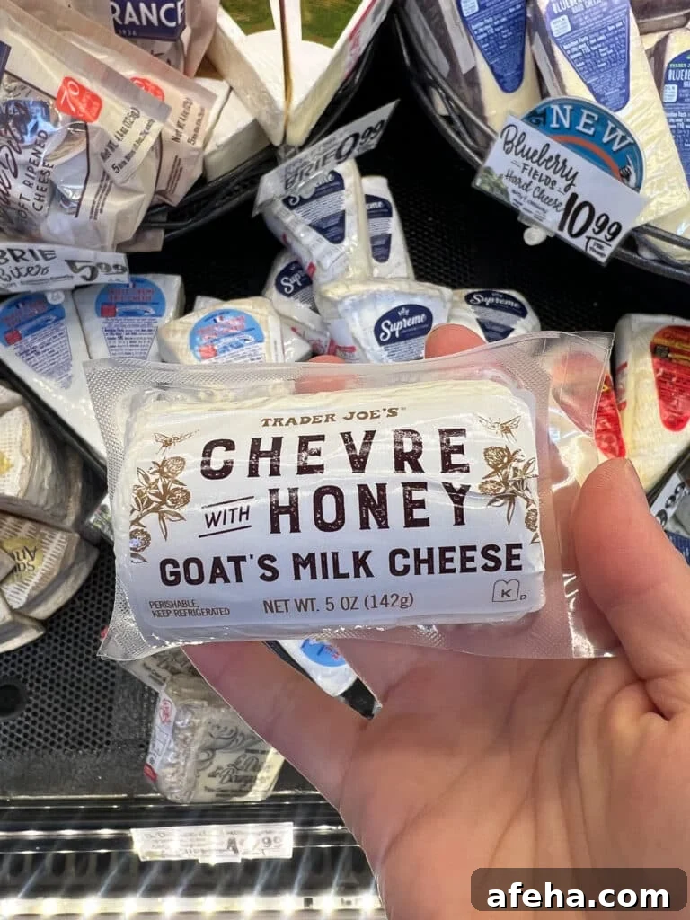 Log of goat cheese with honey in the cheese section of Trader Joe's grocery store