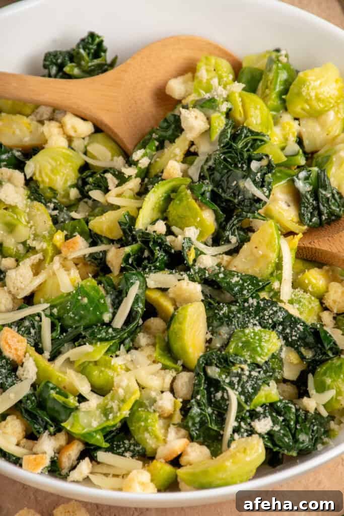 White Bowl with green warm kale and brussel sprouts with shredded cheese and crunchy croutons.