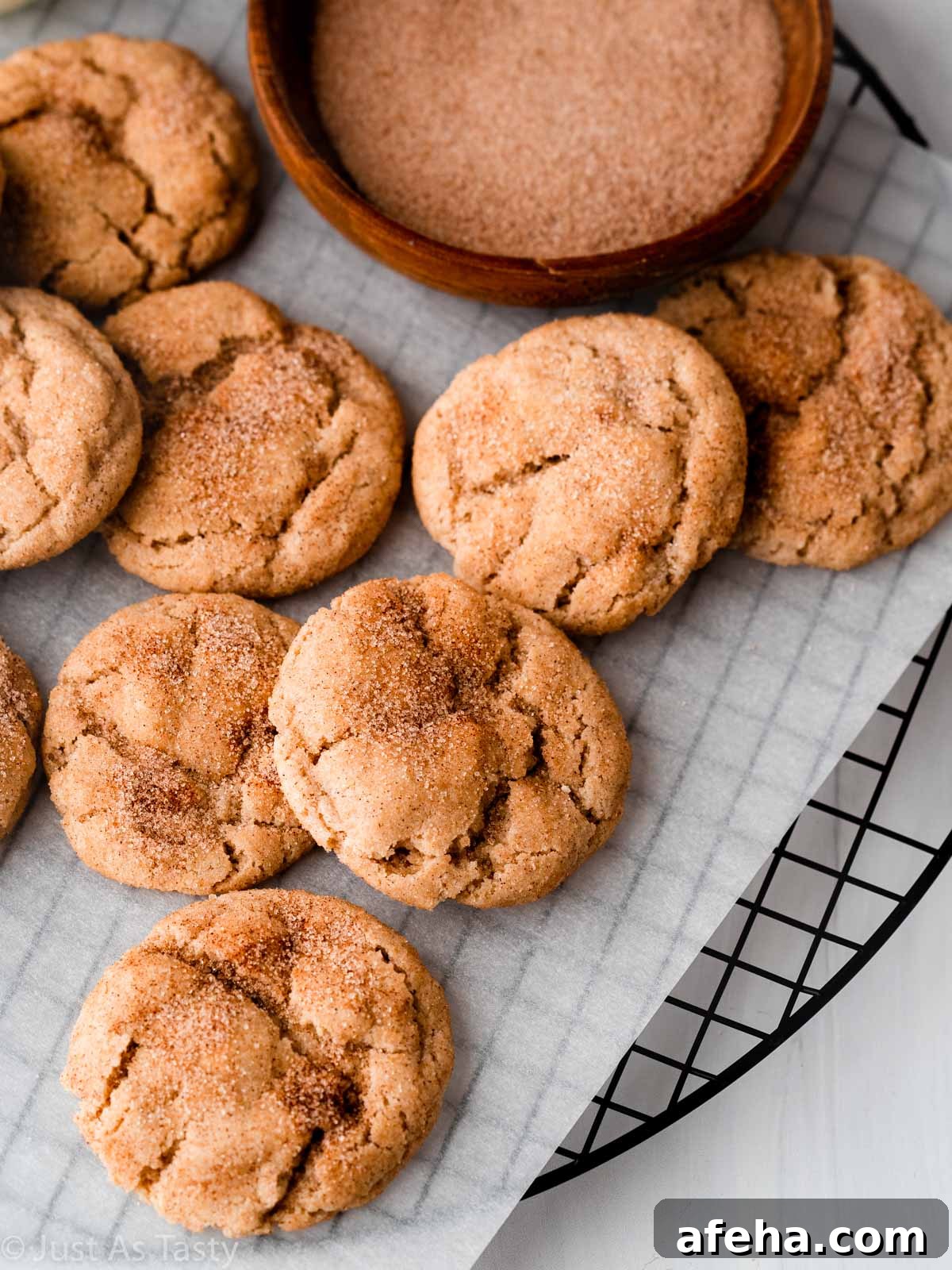 Gluten free snickerdoodles on parchment paper. 