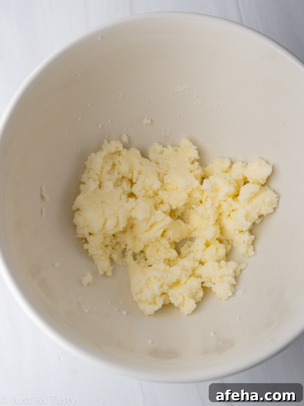 Creamed butter and sugar in a bowl.
