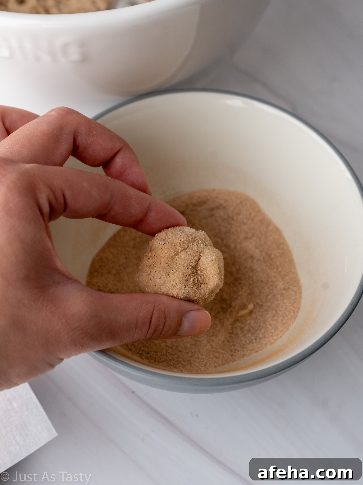 Snickerdoodle dough rolled in cinnamon sugar. 