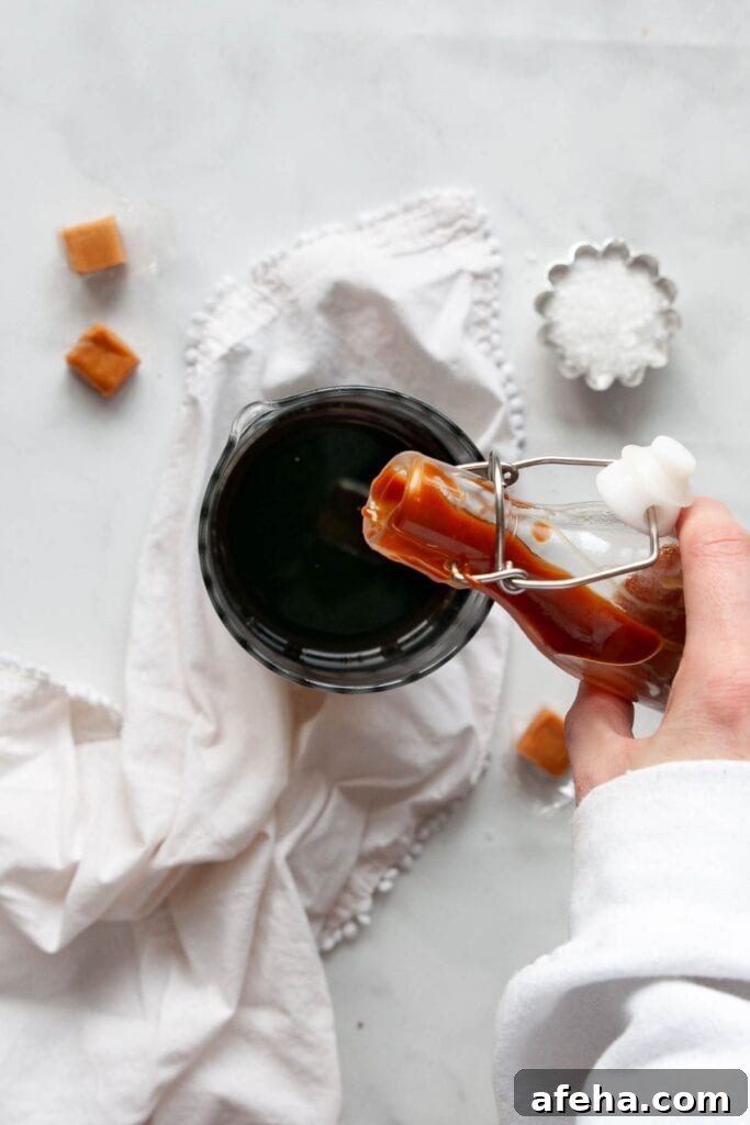 pouring caramel sauce into cold brew