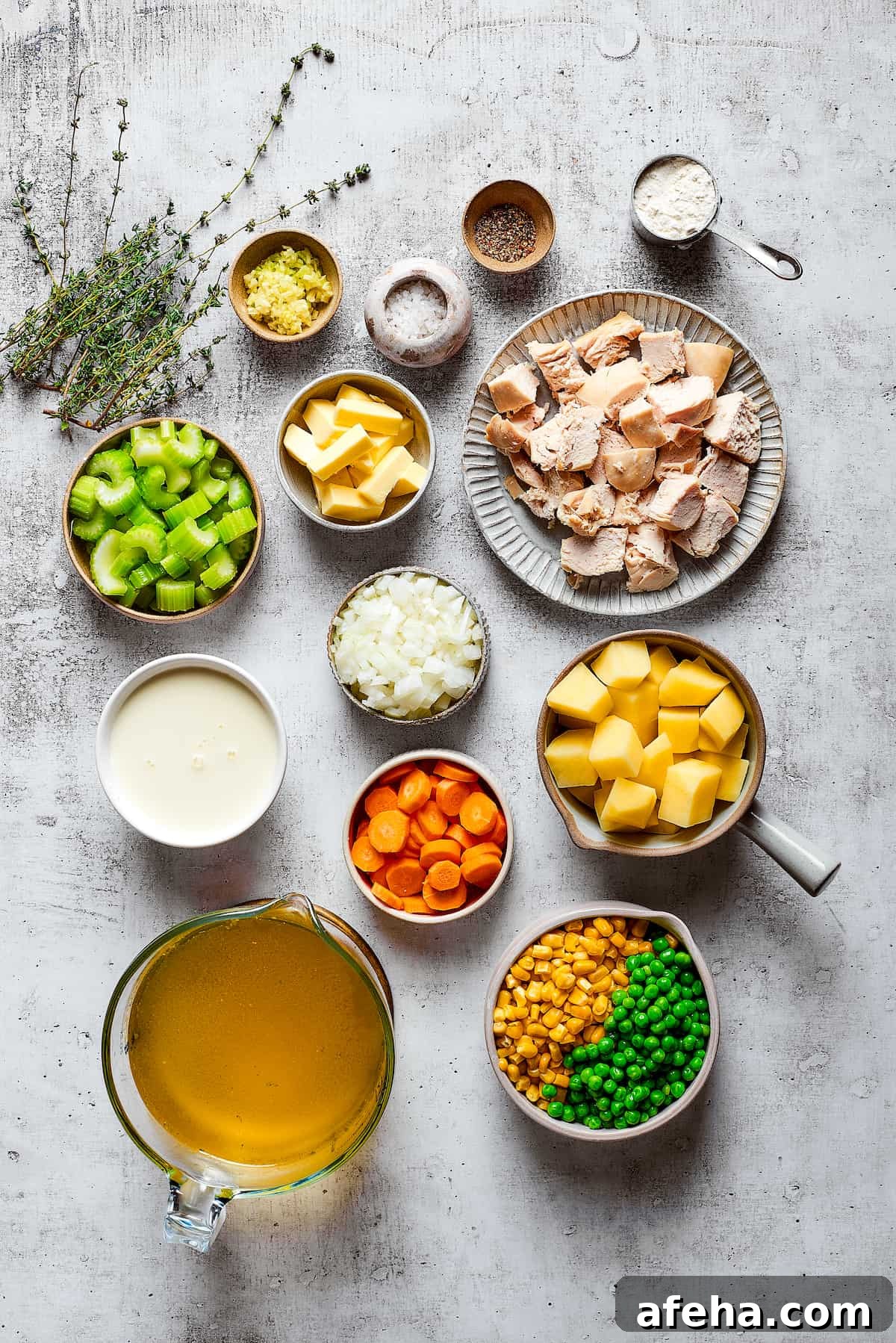 Hearty and comforting chicken pot pie soup has a rich and creamy broth, tender veggies, and juicy chicken, and is so easy to make. Overhead view of the ingredients needed for chicken pot pie soup