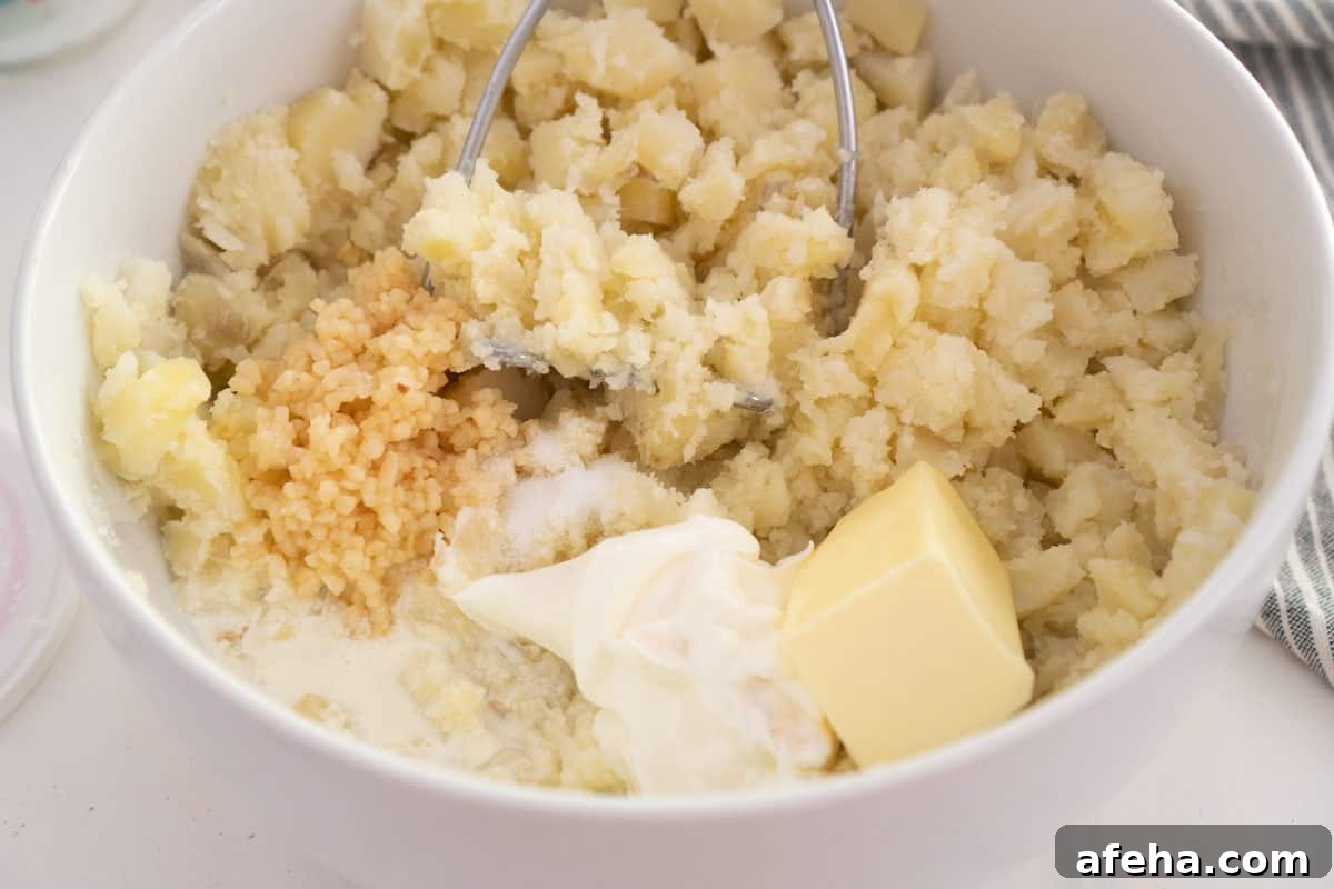 mashed potato ingredients in large white bowl
