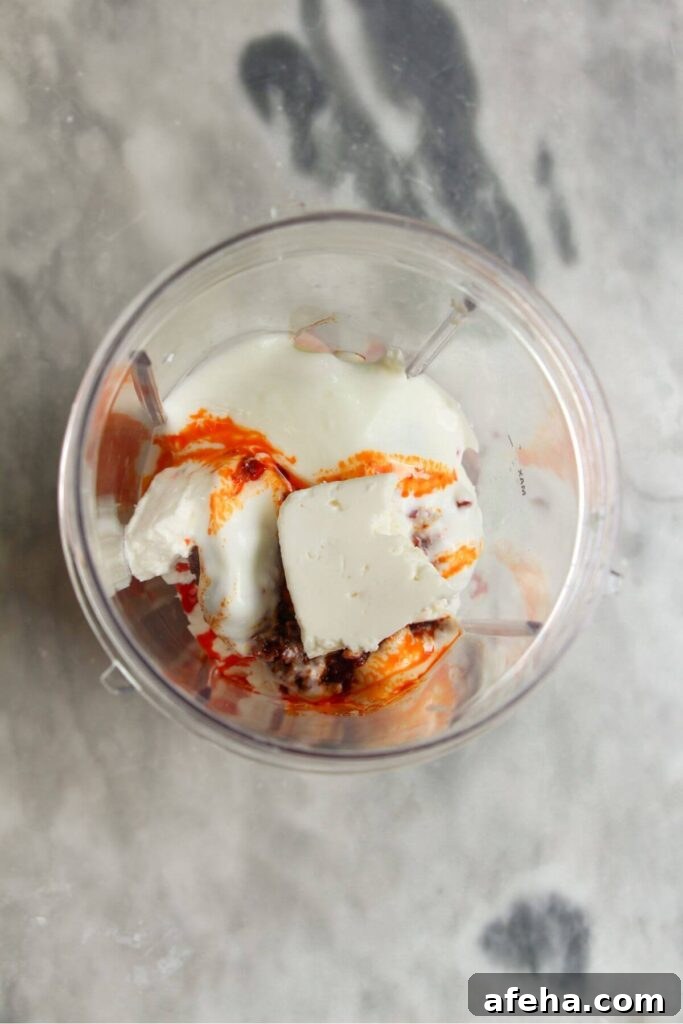 Ingredients for spicy feta dip in a blender.