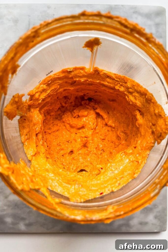 Smooth, blitzed spicy feta dip in a blender.