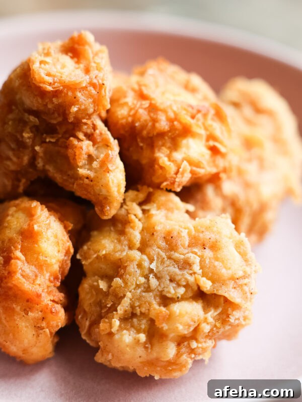 Closeup of vegan fried chicken on pastel purple plate