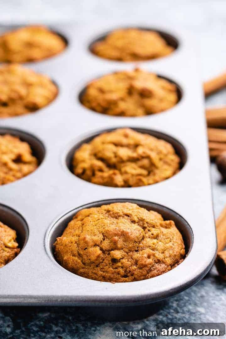 The baked muffins cooling in the muffin tin.