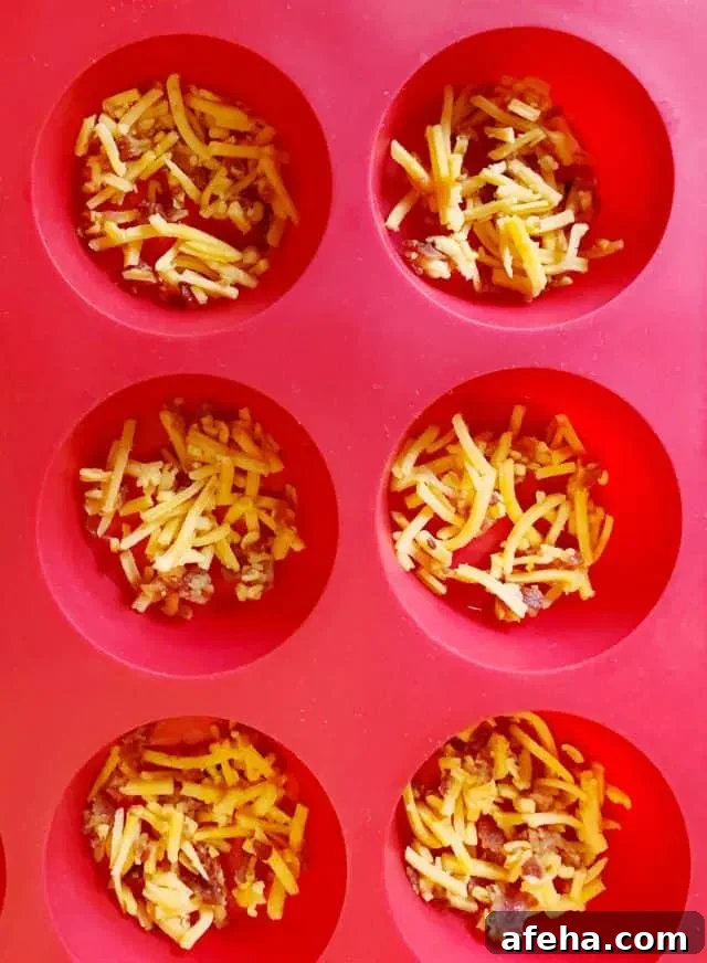 Bacon Cheddar Crisps — Keto Low-Carb Snack Recipe 8 sprinkle in a silicone muffin pan