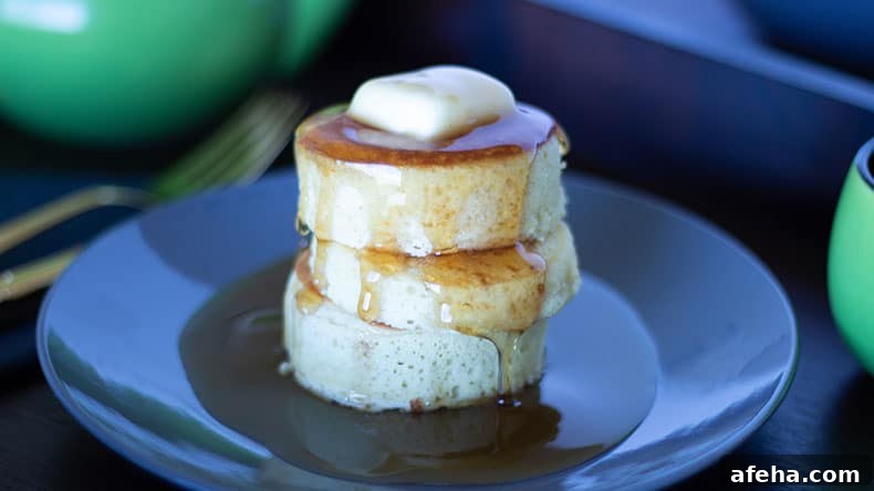3 japanese style pancakes on a black plate