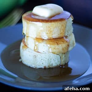 3 japanese style pancakes on a black plate