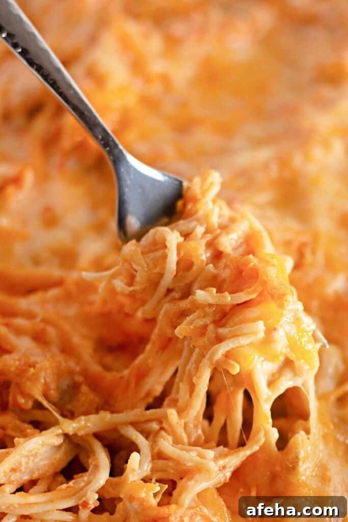 fork with spaghetti sauce twirled on it 