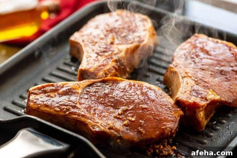 Savory Pork Chop Marinade for Juicy Grilled Pork Chops 5 Marinated pork chops on grill pan