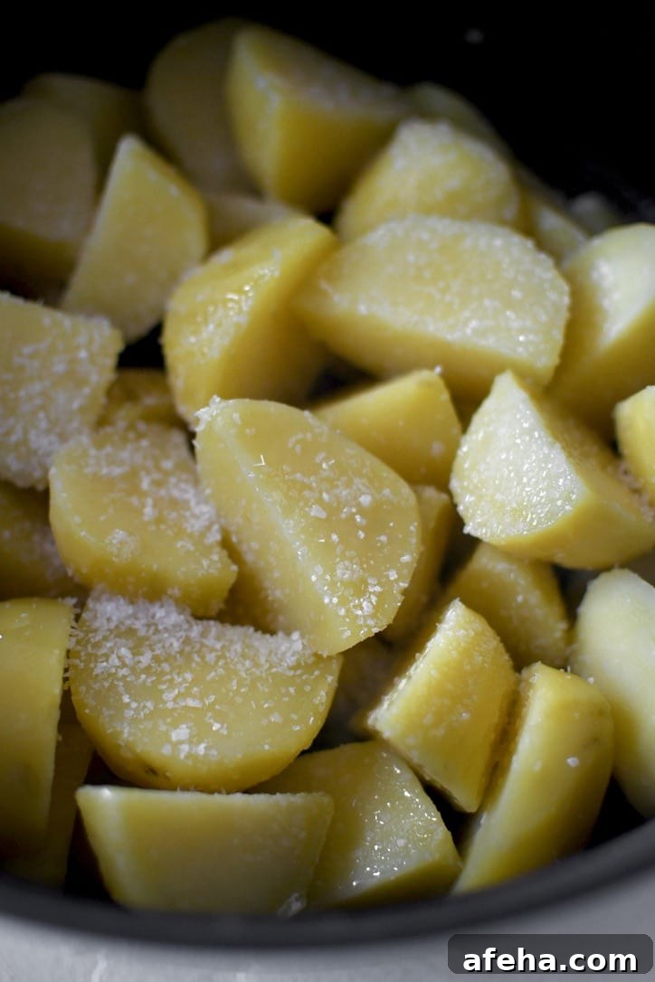 Cut potatoes after boiling seasoned with kosher salt and duck fat.