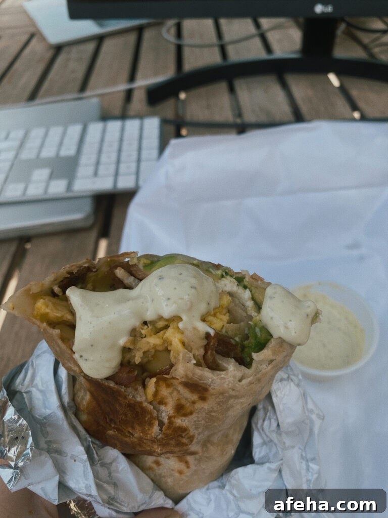 Skiers' Breakfast Burrito from Beaumont Bakery: A Mountain Favorite 4 Breakfast burrito with sauce