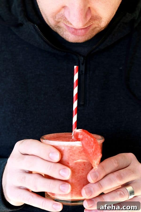 This four ingredient Strawberry Grapefruit Smoothie couldn't be easier! A ruby red grapefruit, strawberries, banana and orange juice are blended together in just seconds to create the perfect easy breakfast or snack.
