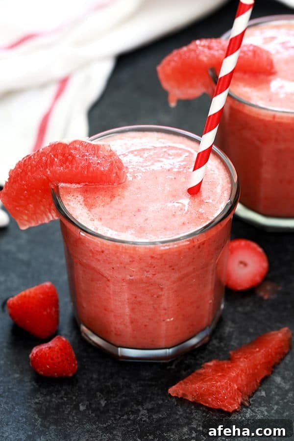 This four ingredient Strawberry Grapefruit Smoothie couldn't be easier! A ruby red grapefruit, strawberries, banana and orange juice are blended together in just seconds to create the perfect easy breakfast or snack.
