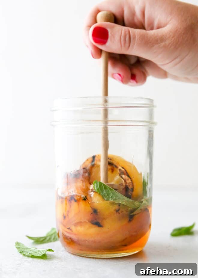 Just 5 ingredients for this grilled peach whiskey smash!