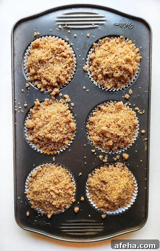 add the crumb topping on top of the muffin batter