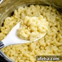 instant pot mac and cheese with a serving spoon