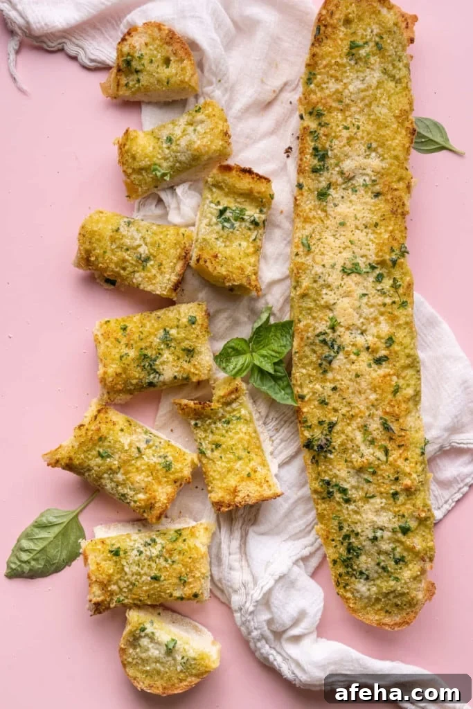 Pesto Butter Garlic Bread with half sliced and half whole