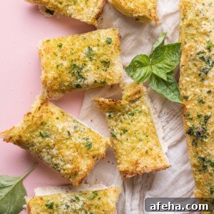 Pesto Butter Garlic Bread on pink background
