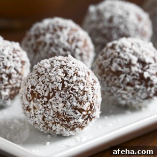 coconut rum balls on a white plate