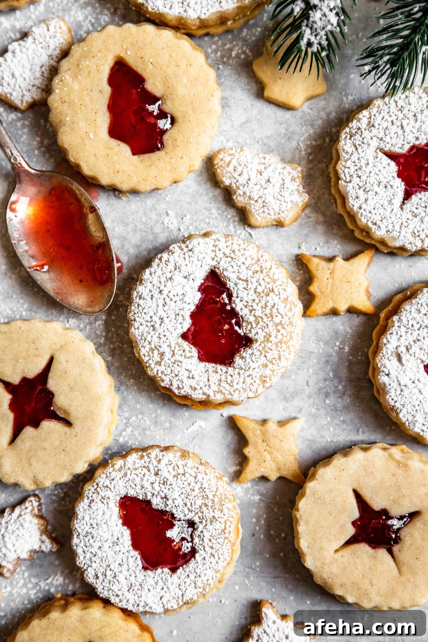 Close up of Strawberry Cardamom Linzer Cookies dusted with powdered sugar